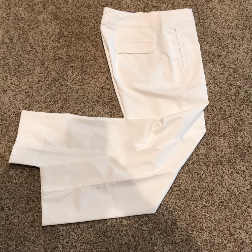 Woman’s white Nike Golf Dri Fit golf pants